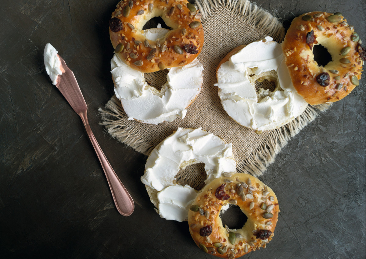 bagels with cream cheese-on black background.