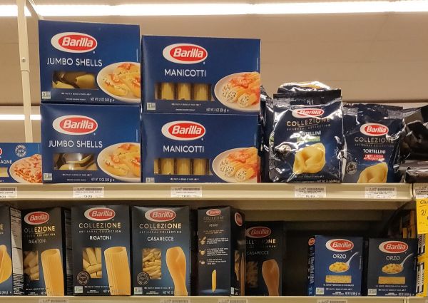Safeway Italian food aisle with Barilla pasta: jumbo shells, manicotti, rigatoni, casarecce, orzo, tortellini.