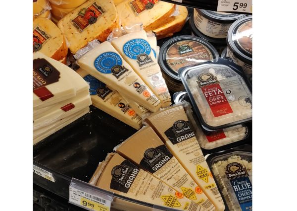 Italian cheeses on display at Safeway: Parmesan, Grana Padano, Feta, Gouda, Asiago, and Blue Cheese.