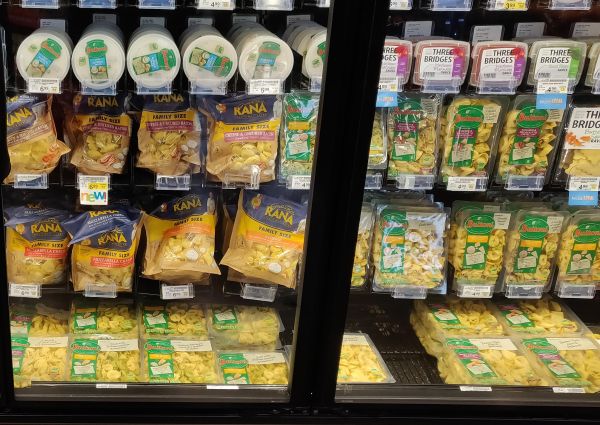 Refrigerated section at Safeway with Italian food products: Rana pasta, Bertolli tortellini, and Three Bridges ravioli.