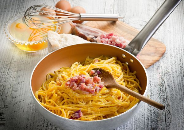 Carbonara pasta in pan. Ingredients: eggs, bacon, cheese. #CarbonaraDay #Pasta #ItalianFood