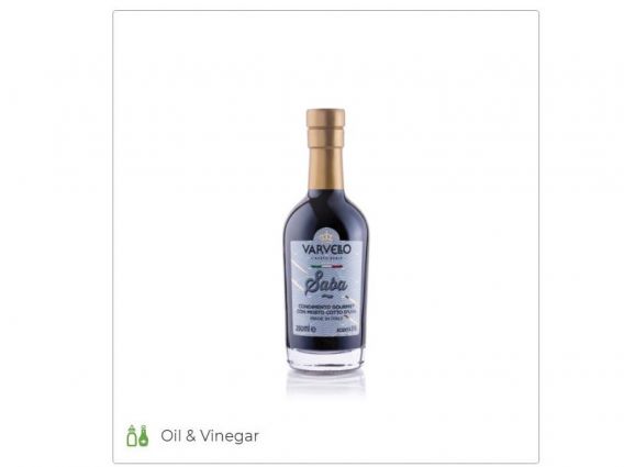 Varvello Saba Condiment. Gourmet balsamic vinegar glaze in a glass bottle with gold cap. Italian food tradition.
