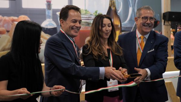 Italian Food Awards USA 2019 ribbon cutting. People with Italian flag ribbons.