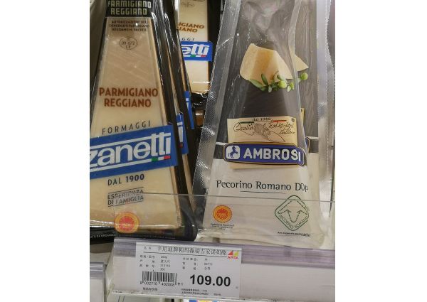 Parmigiano Reggiano Zanetti and Ambrosia Pecorino Romano cheese in Shanghai high-end store. Italian cheese.