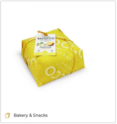 Wrapped Balocco Panettone. Italian Christmas bread in yellow packaging with tag. Bakery product.