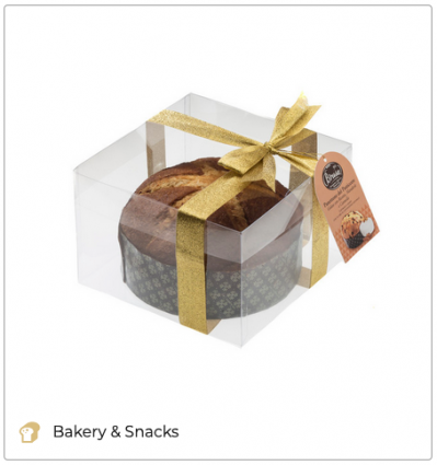 Brusa Panettone in clear gift box with gold ribbon. Italian sweet bread. Christmas tradition.