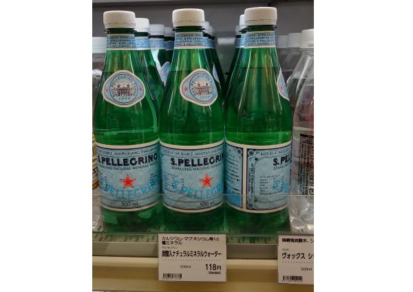S. Pellegrino sparkling water bottles on a shelf in Osaka, Japan. Italian food experience.
