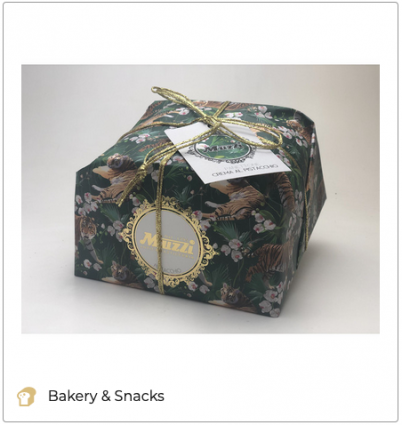 Muzzi Panettone gift box. Italian Christmas cake with pistachio cream. Festive packaging.