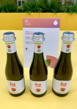 Three bottles of Bioplose organic tomato juice at SANA 2019. Italian organic product.