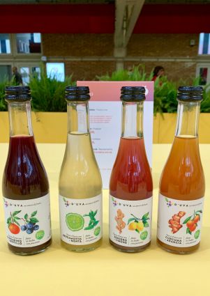 Italian organic juices from D'UVA at SANA 2019: mandarin-blueberry, bergamot-mint, ginger-lemon, and turmeric-orange.