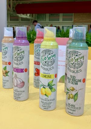 Italian organic olive oil spray bottles. Flavors include garlic, lemon, ginger, and pepperoncino. SANA 2019.