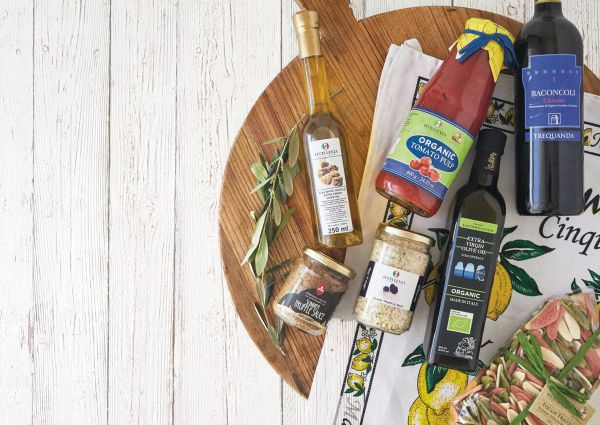 Italian food products: truffle oil, truffle sauce, tomato pulp, Chianti wine, olive oil, truffle rice, and pasta.