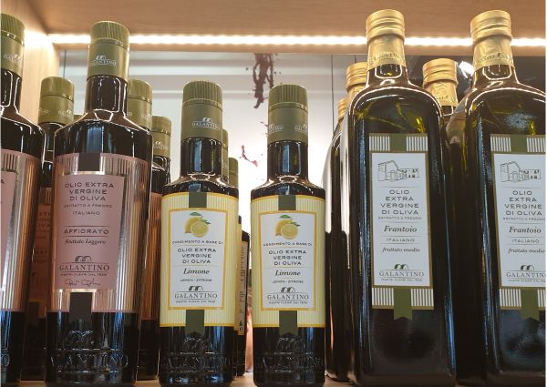 Galantino Italian olive oil bottles on display at Anuga food trade show. Extra virgin, lemon, and frantoio varieties.
