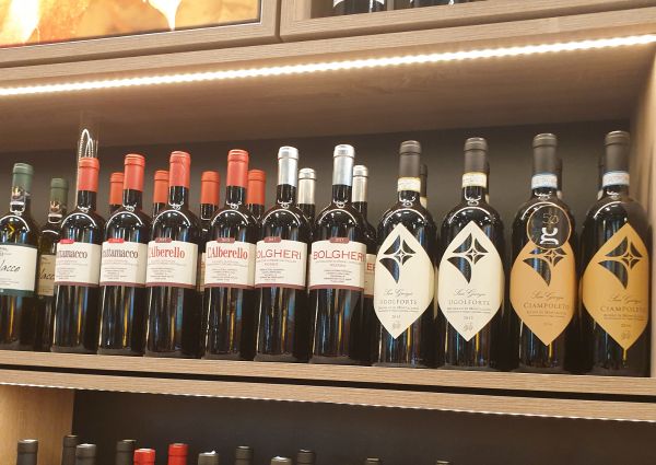 Italian deli wine selection. Red wine bottles on display at Di Gennaro's Anuga showcase.
