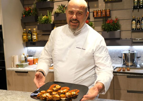 Chef Andrea Zanin presents appetizers. US tariffs impact food costs.