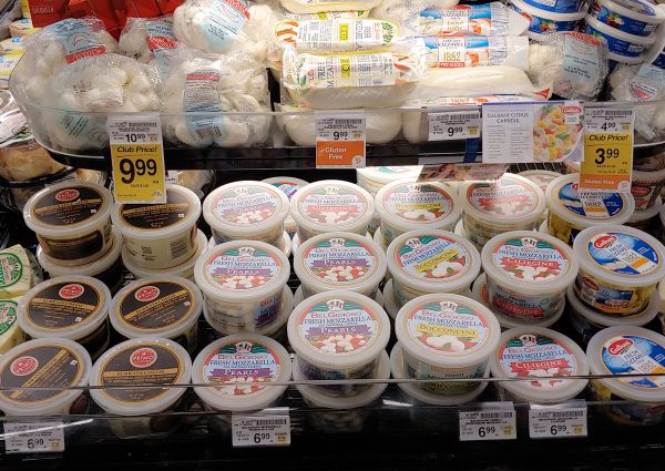 Safeway's selection of natural quality mozzarella. Fresh mozzarella pearls, bocconcini, and ciliegine cheeses on display.