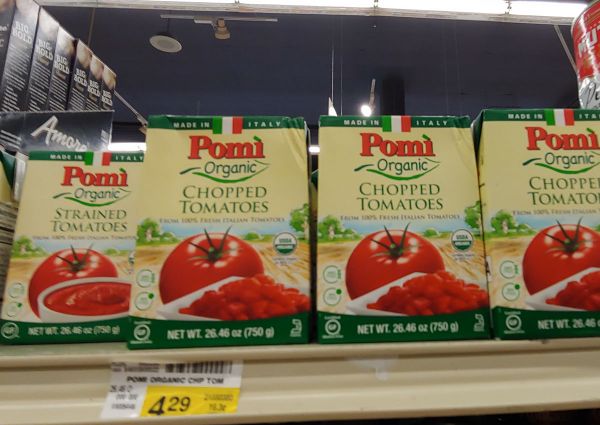Safeway grocery shelf with Pomi Organic chopped and strained tomatoes. Natural, quality Italian tomato products.