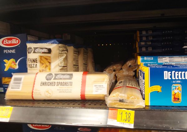 Walmart Supercenter aisle with Italian pasta brands: Barilla, De Cecco, and Sam's Italia enriched spaghetti.