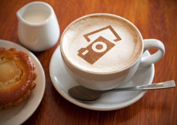 Italian coffee with camera art, pastry, and milk. Coffee capsules are the new black.