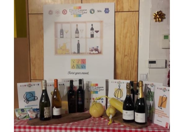 European Quality Food display in Warsaw. Features wine, cheese, and promotional material. Enjoy European Quality Food.