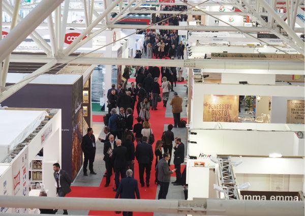 Marca 2020, Italy: Crowded private label trade show with red carpet and exhibitor booths. Business event.