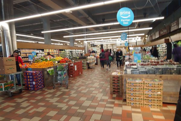 Inside Whole Foods Market: Italy takes center stage with fresh produce, grocery aisles, and shoppers. Prime Member Deal.