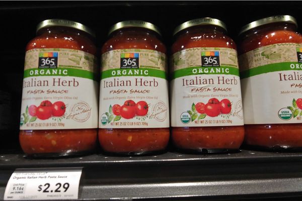 365 Organic Italian Herb Pasta Sauce jars on a shelf at Whole Foods. Italian food.
