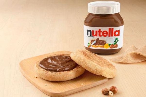 Italian McCrunchy with Nutella. Sweet bread with chocolate hazelnut spread and a jar of Nutella. McDonald's Italy dessert.
