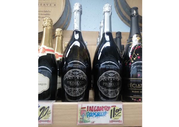 Trader Joe's Italian Prosecco wine bottles on a shelf. Discover affordable sparkling wine.