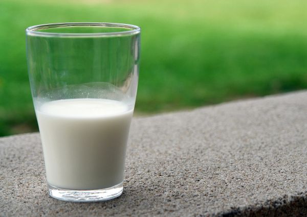 Glass of fresh Italian milk. Dairy drink produced by Italian food producers.