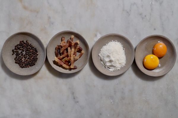Carbonara ingredients: pepper, guanciale, pecorino romano cheese, and egg yolks. #CarbonaraDay
