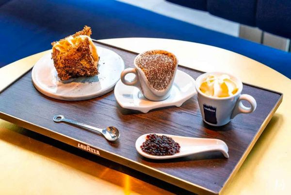 Lavazza coffee and dessert set. Aria di Cappuccino, cake, jam, and coffee on a tray. Lavazza launches in China with Yum Brands.