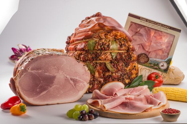 Piacenti's Arrosto TSG: Tuscan roasted ham, prosciutto slices, and fresh vegetables. Traditional Italian charcuterie.