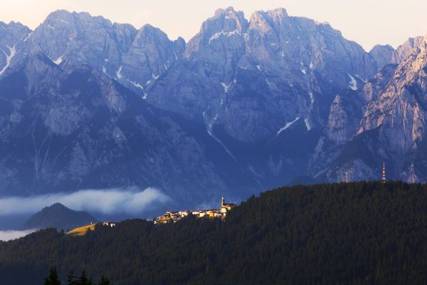 Dolomiti mountains landscape. Piave PDO cheese origin. Italian Alps view.