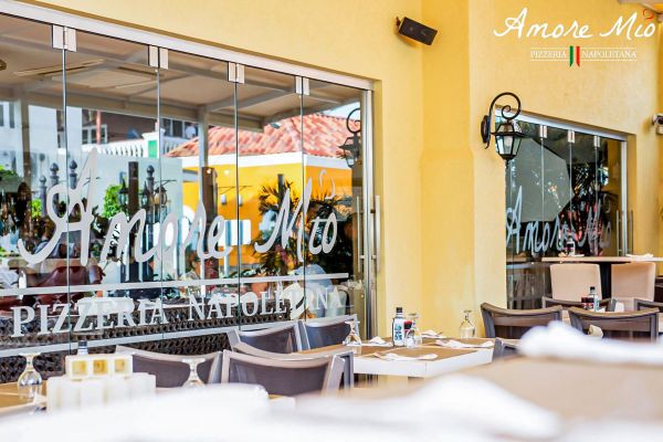 Amore Mio Pizzeria Napoletana, a Gianni's Group Italian restaurant in the Caribbean. Outdoor dining area.