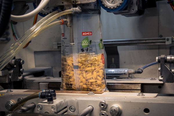 Agnesi pasta packaging on a Colussi production line. Compostable pasta pack.