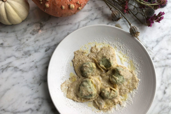 Chef Paolo Laboa's Ligurian pansotti pasta dish with creamy sauce and fall decor. Maine food.