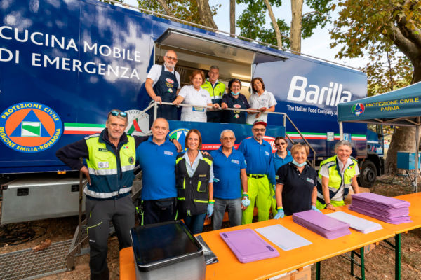 Barilla Group's commitment to sustainability. Mobile kitchen for emergency. Barilla staff and volunteers.