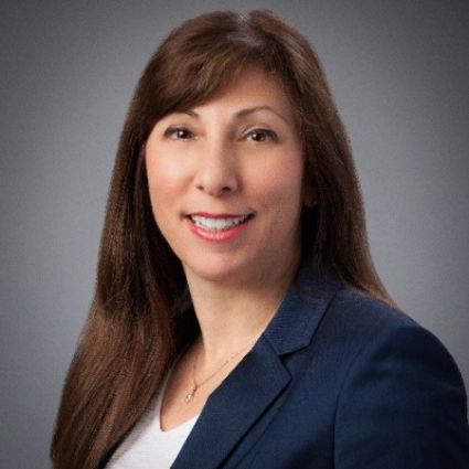 Woman in navy blazer. U.S. retailers discuss Italian food trends.