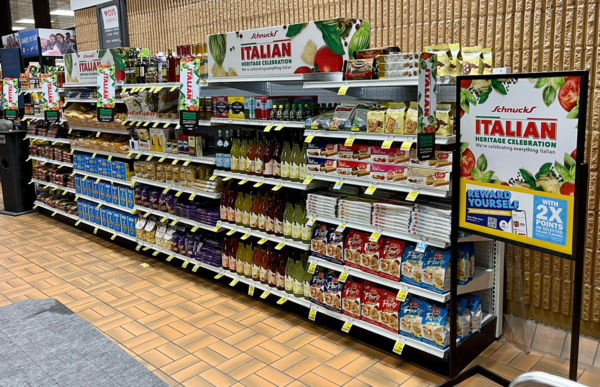 Schnucks Italian food aisle. Retail display of Italian heritage celebration products. Grocery store with pasta, sauces, and snacks.